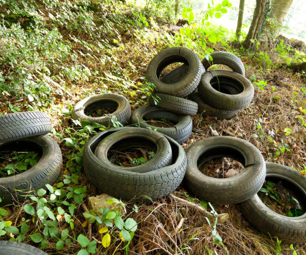 Pile of car tyres in the countryside